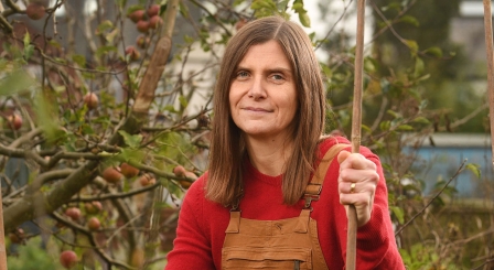Melanie Renowden in dungarees in allotment