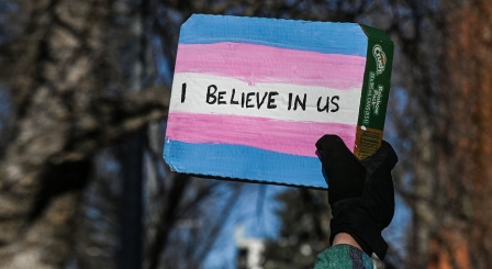 I believe in us sign on transgender flag