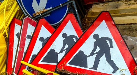 Men at work road sign