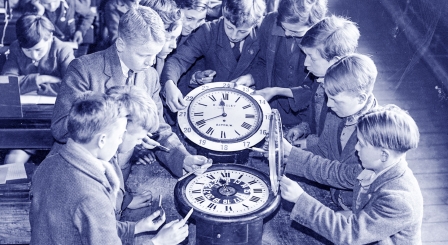 School boys working with clocks