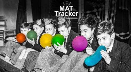School boys blowing up balloons