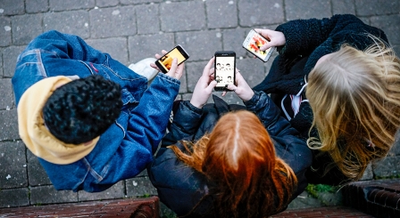 School children with mobile phones