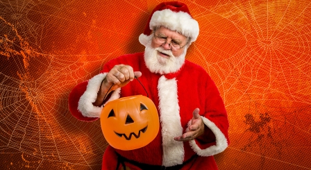 Santa with a halloween trick or treat bucket