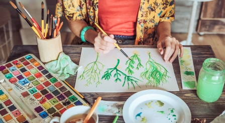 Someone painting plants