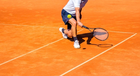 Tennis player returning serve