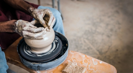 Hands on a pottery wheel