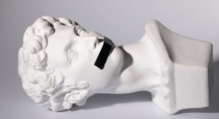 Bust with tape over mouth Silence