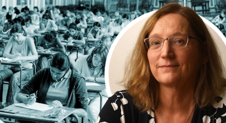 A woman with glasses and an exam hall