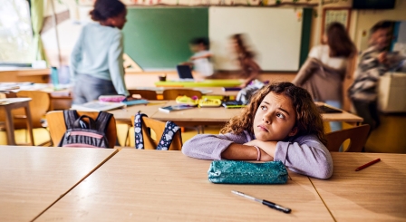 Pupil sitting on her own
