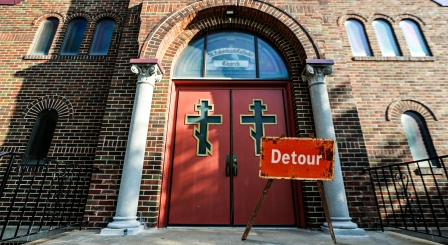 Church doors with detour sign