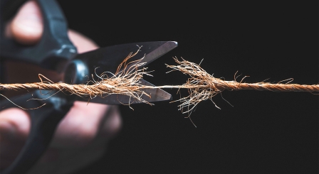 Scissors cutting rope