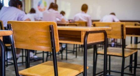 Empty chair in classroom