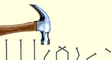 Hammer hitting nails