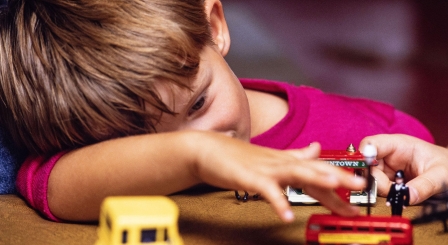 Small boy playing with toys