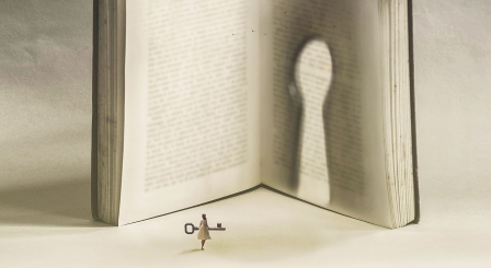 Girl with key to a book