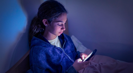 Girl looking at phone screen
