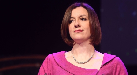 Bridget Phillipson on stage in pink