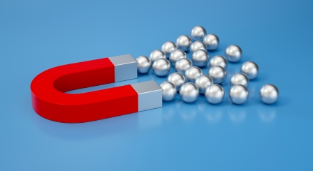 A magnet attracting balls