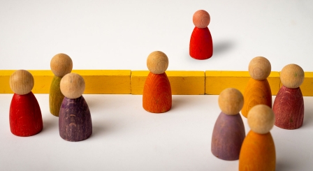 Figures either side of fence