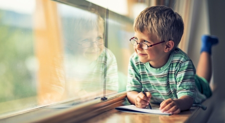 School boy at window