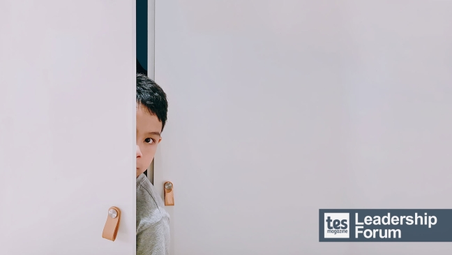 Child hiding in cupboard