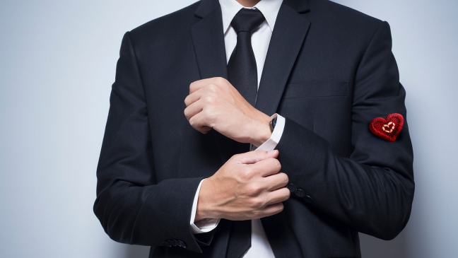 Man in suit with heart on sleeve