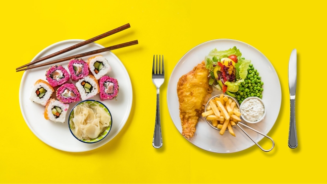 Sushi and fish and chips on plates