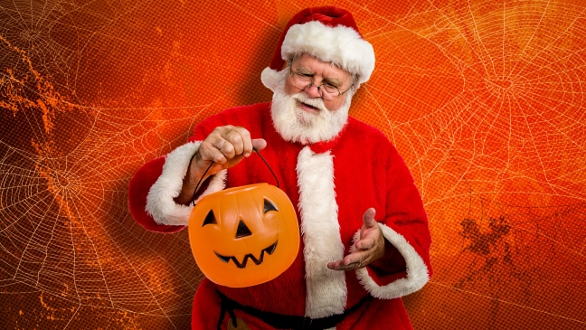Santa with a halloween trick or treat bucket
