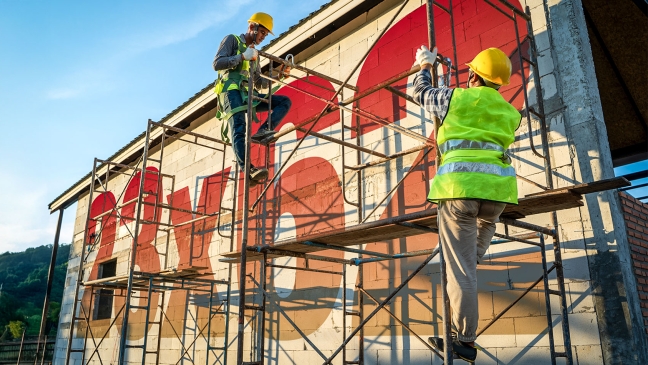 Numbers on side of building with scaffold