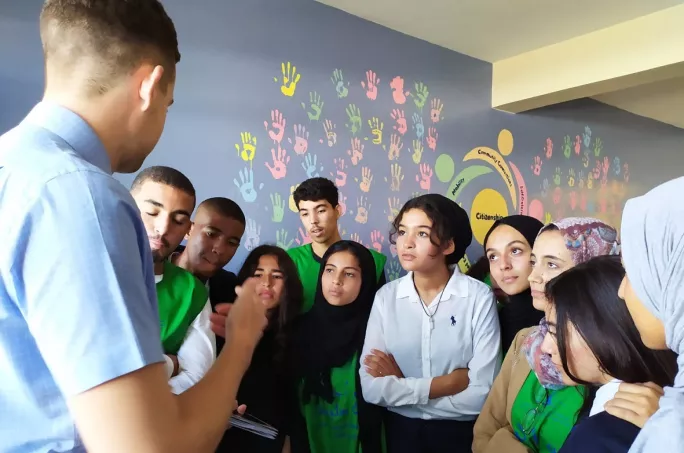students in morocco listen to their teacher