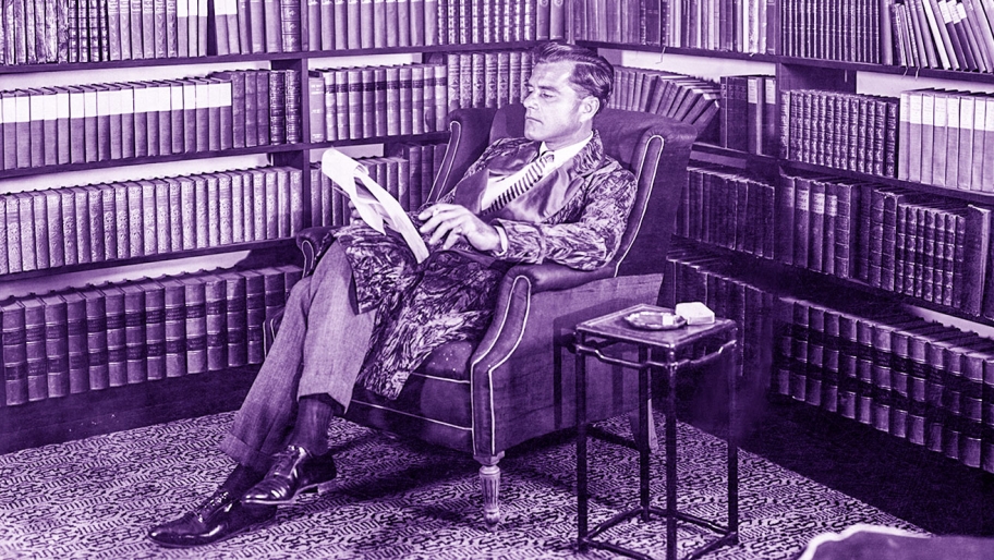 Gentleman quietly reading in an armchair