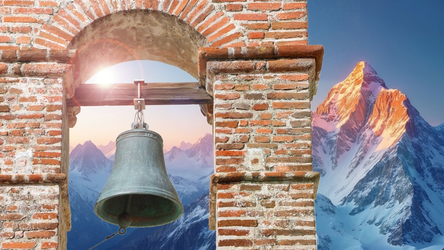 Bell tower with mountain range