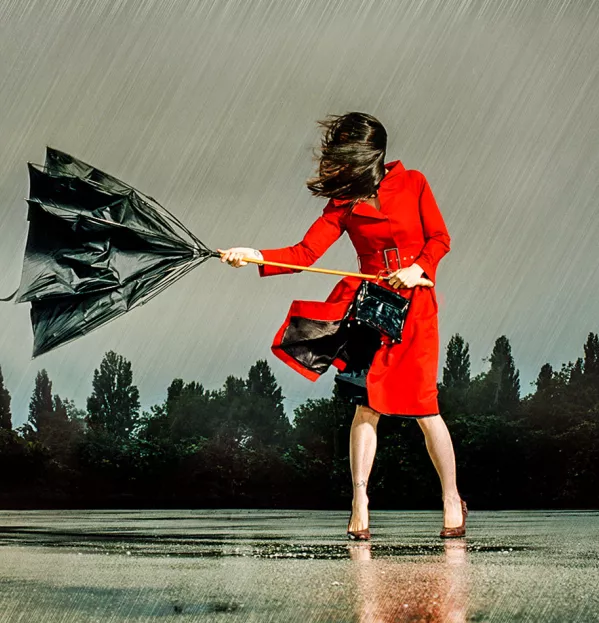 Lady with broken umbrella