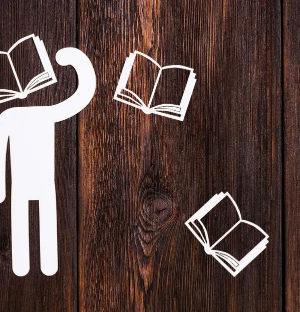 Paper man with book for head
