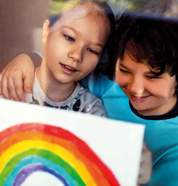 A Young Girl & Boy Affix A Rainbow Painting To A Window – Catch Up School Emotional Support