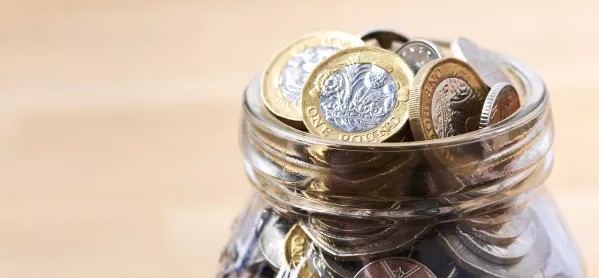 pot of money with pound coins 