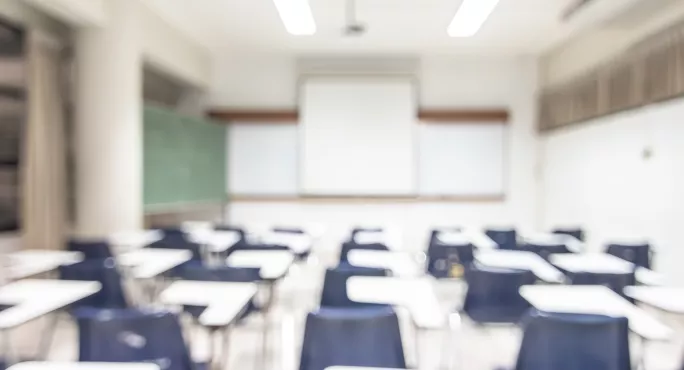 blurred image of empty classroom