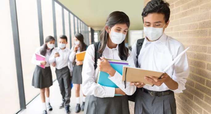 Local public health directors in some areas have called for masks to remain in communal areas of schools.