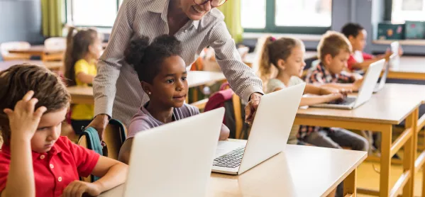 pupils on laptops in classroom 