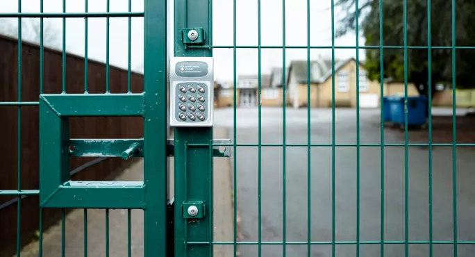 green school gate with key pad