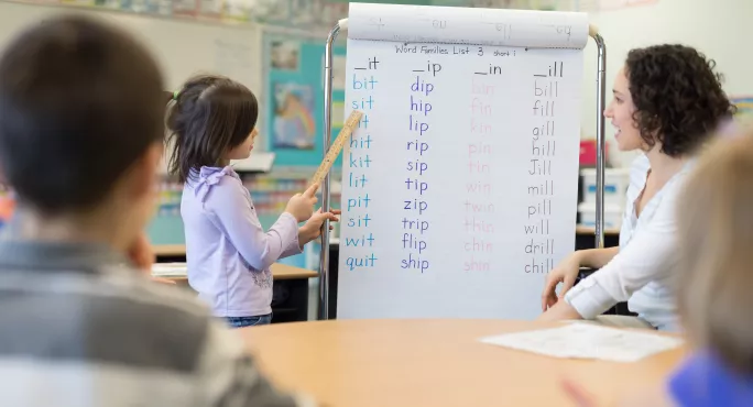 School classroom with spelling practice on board