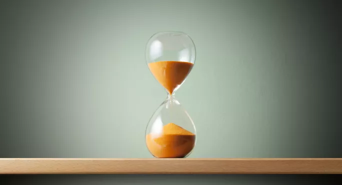 Hourglass with orange sand 