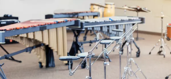 Still life photo of percussion instruments in a high school band room