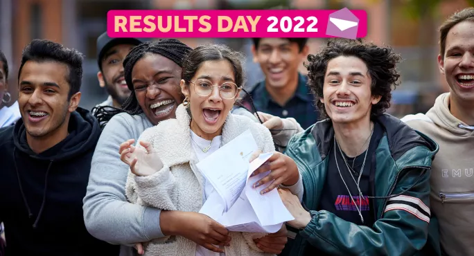 Group of students smiling and hugging with their results