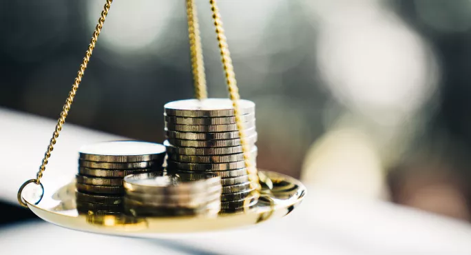 Coins stack with balance scale.