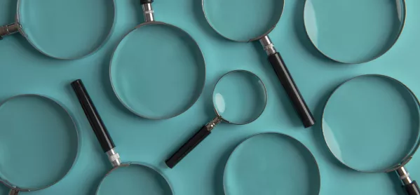 Magnifying glasses on teal background