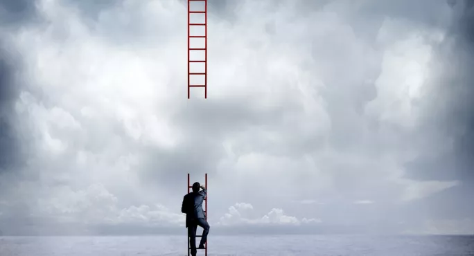 Businessman Climbing Incomplete Ladder