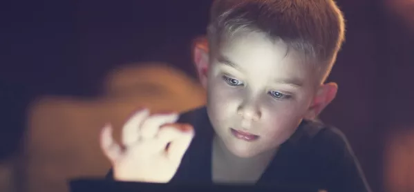 Boy looking at digital device