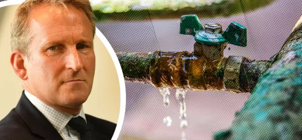Damian Hinds beside a leaky pipe