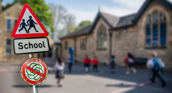 School sign with a 'No ChatGPT' sign